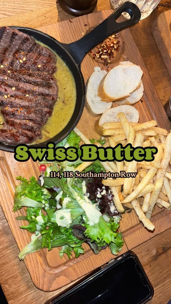 The video showcases a Valentine's Day dinner at Swiss Butter restaurant in London. It features various dishes including beef filet and salmon with a green sauce, french fries, baguette, salad, molten chocolate dessert, and pain perdu.  The food is presented on wooden platters. The video focuses primarily on the meal, with shots of the food and drinks, and the influencer enjoying their meal.