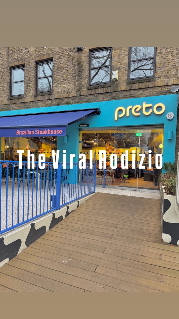 This video showcases Preto Restaurant, a Brazilian Churrascaria in Angel, London. It features a buffet of hot and cold Brazilian dishes, including various salads, rice, fries, and stews. The main focus is the unlimited meat served tableside on skewers. The video also shows desserts, including ice cream and cakes.  The video highlights the 'More Please'/'I'm Full' card system for managing meat service. 