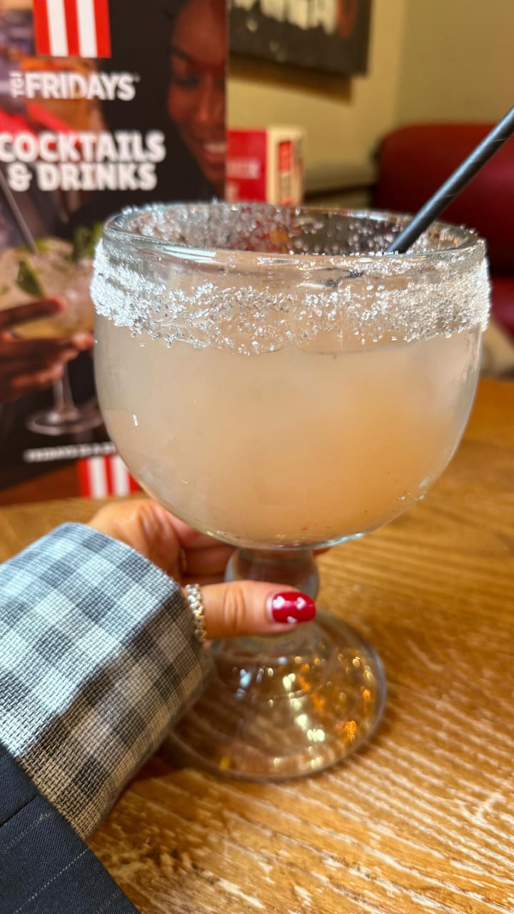 A promotional video showcasing the 'Everyday Trio' menu at TGI Fridays, highlighting the affordability of the offer with shots of the menu, drinks, and various food items like corn ribs, quesadillas, and dessert.