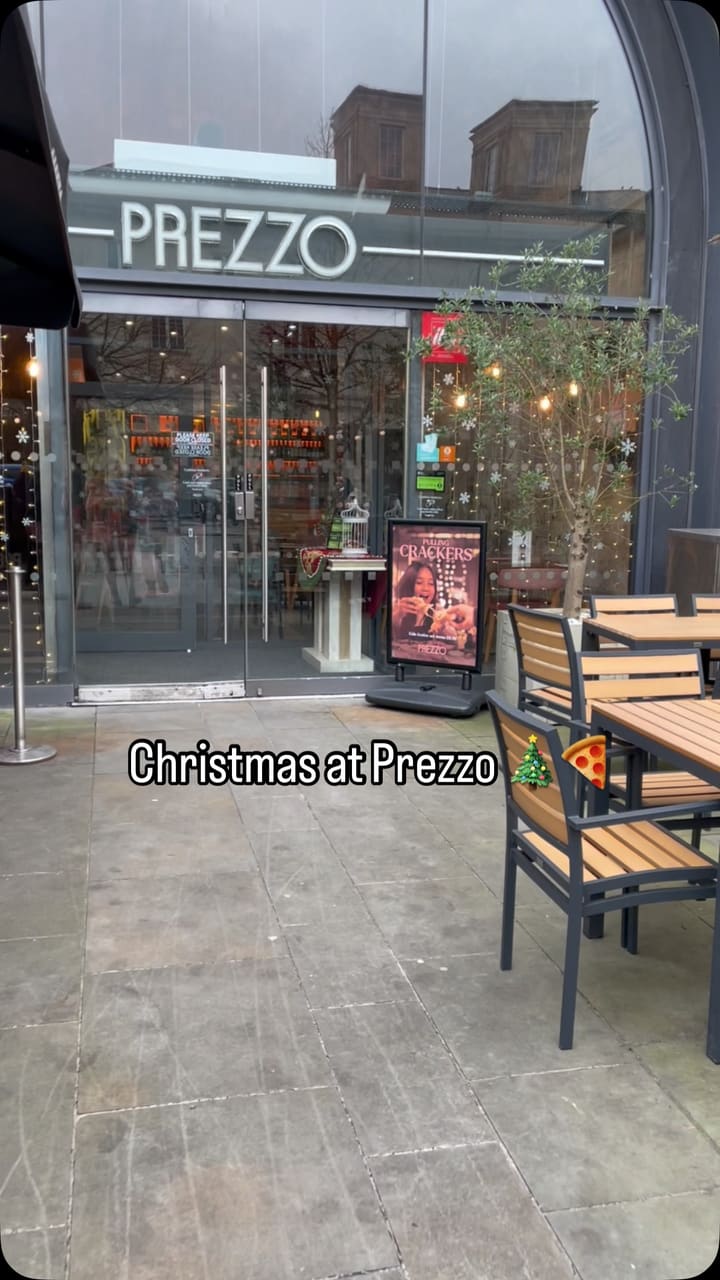 This video showcases a Christmas set menu at Prezzo in Bath. It features various dishes including starters (Gorgonzola & Cranberry Dough Twist and Tomato Bruschetta), mains (Goat's Cheese & Roasted Peppers Pizza and Tuscan Beef Stew), desserts (Tiramisu and Prezzo's Best Ever Chocolate Cake), and a Baileys Latte. The video highlights the restaurant's ambiance and includes information on pricing and dietary options.