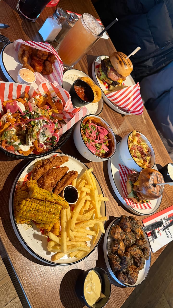 A promotional video showcasing the 'Everyday Trio' meal deal at TGI Fridays, featuring a variety of appetizers, mains, and drinks.