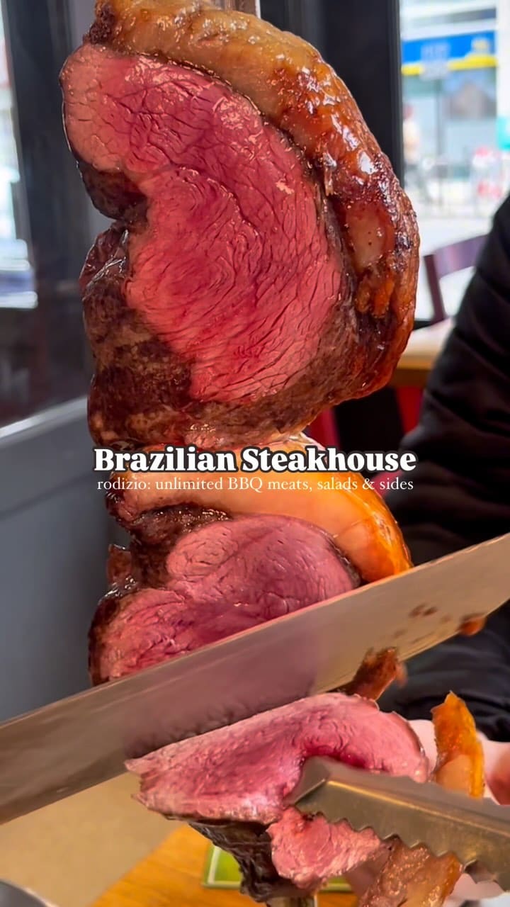 The video showcases a Brazilian steakhouse rodizio experience. It features various cuts of BBQ meats (including sirloin, pork ribs, garlic steak, lamb, spicy chicken, gammon, pepper steak, lemon chicken, pork sausage, rump steak, and chicken hearts) being sliced directly from skewers onto a plate. The primary focus is on the continuous serving of different meats.