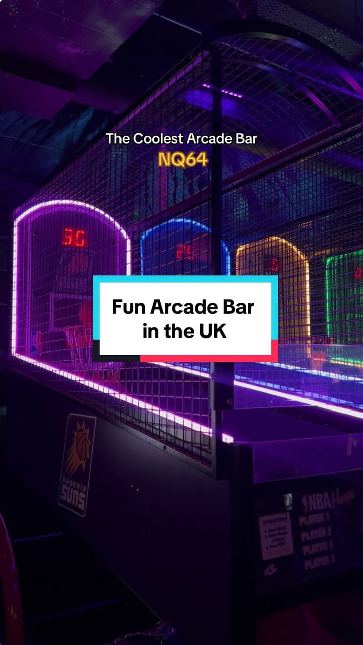 This TikTok video showcases NQ64, an arcade bar with multiple locations in the UK. The video provides a vibrant tour of the bar, highlighting its neon aesthetic, various arcade games (including racing games, dance games, and light gun games), and a cocktail menu. The video focuses on the lively atmosphere and fun activities offered at the arcade bar.  While specific drinks are shown, there's no detailed description of their ingredients or dietary information provided.
