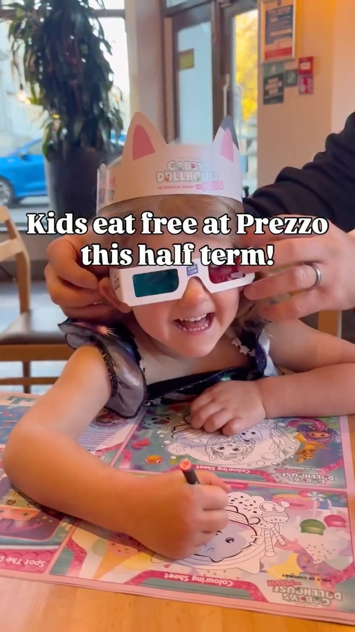 The video promotes a 'kids eat free' offer at the Italian restaurant chain Prezzo, in collaboration with the 'Gabby's Dollhouse' movie. It features a family with a young child enjoying a meal. The video showcases the child participating in themed activities, eating a cat-shaped pizza, and having ice cream. It also displays several adult dishes, including calamari, mozzarella sticks, a pepperoni pizza, lasagne, and salmon with a sauce being poured over it.