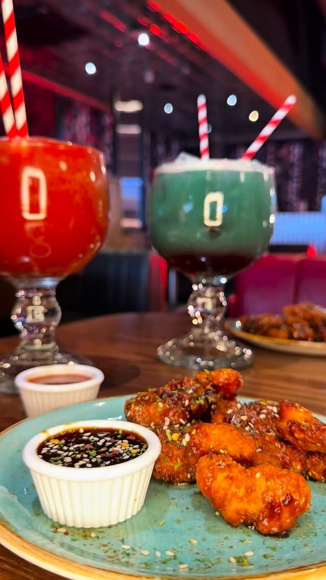A promotional video for TGI Fridays featuring their bottomless sesame chicken offer. The video showcases the restaurant interior, the food, the drinks, and a photobooth, using fast-paced cuts and text overlays to highlight the deal details.